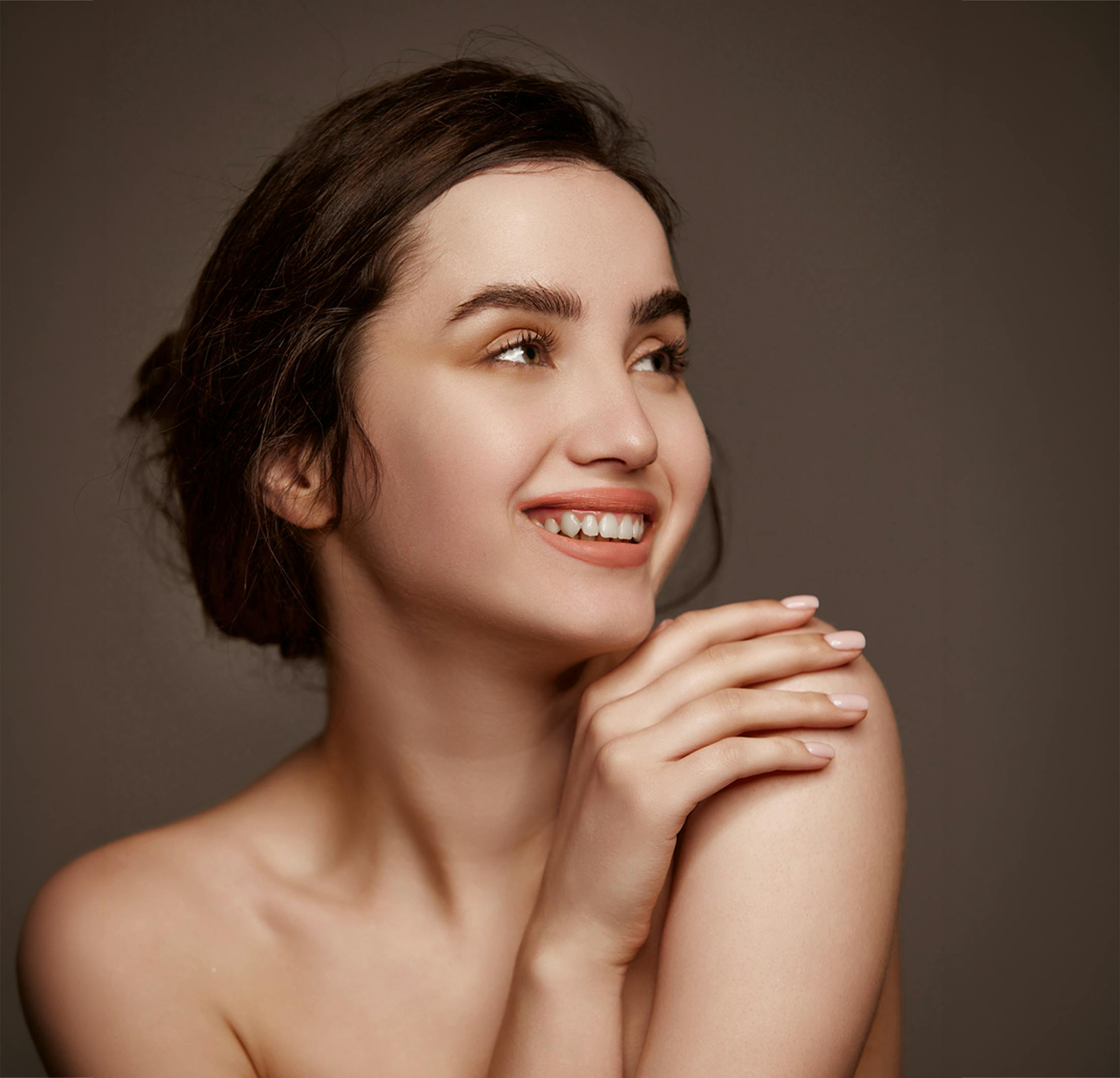 Woman touching her shoulder