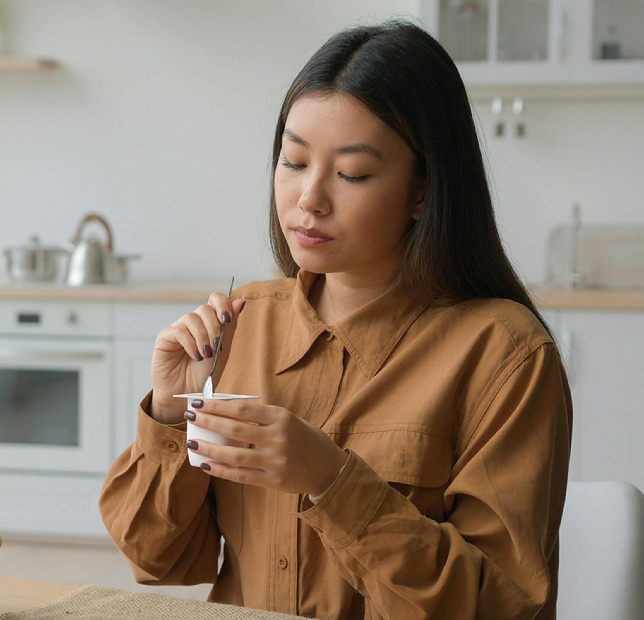 woman eating yogurt