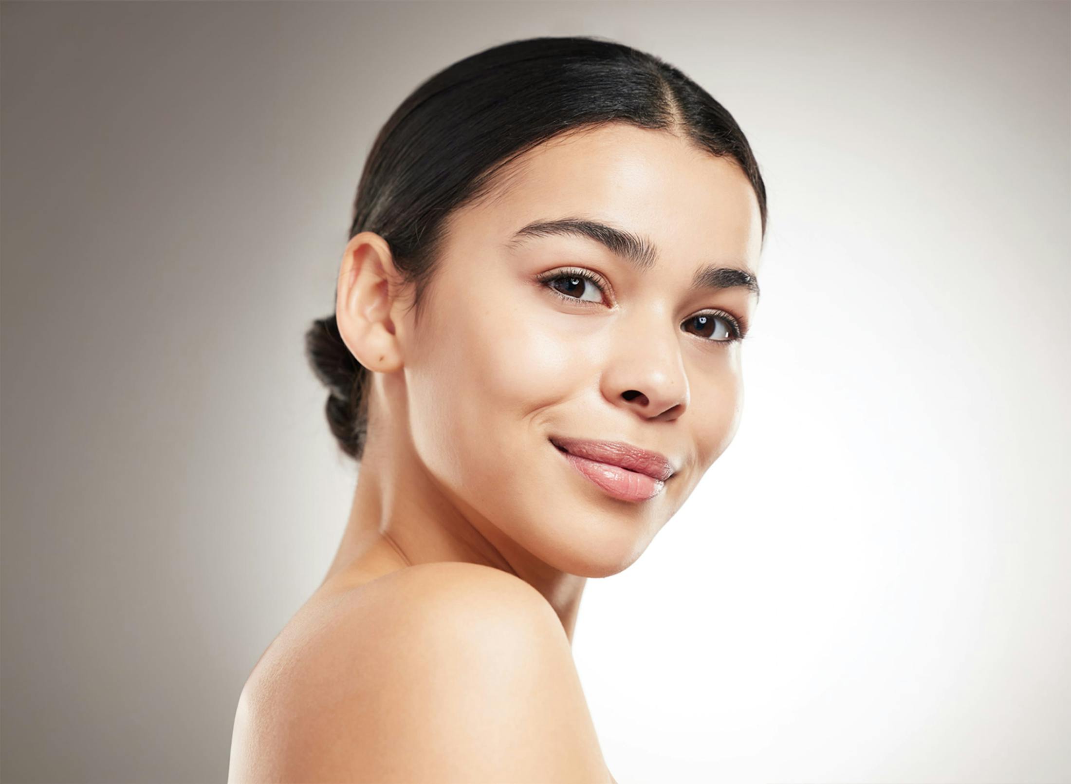 smiling woman with a bun