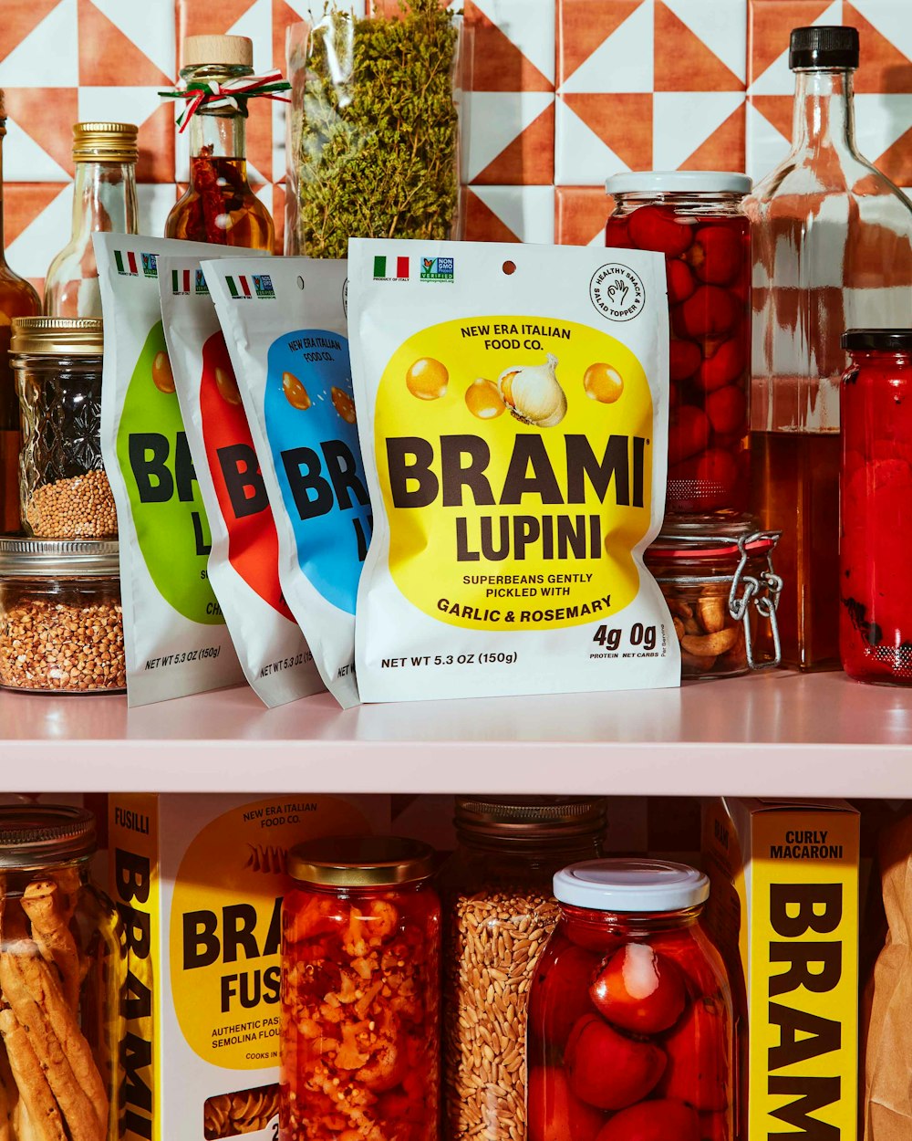 Brami lupini bean packaging displayed on a pantry shelf with jars, bottles and Italian food staples.