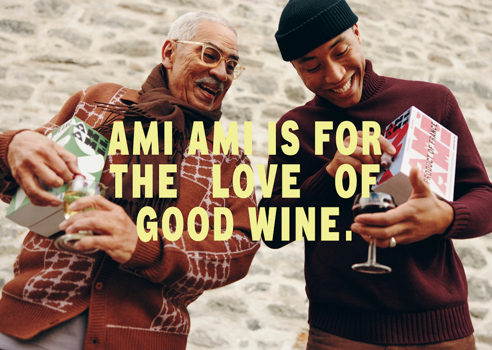 Two peoples enjoying a glass of wine. A big paragraph in pale yellow saying: "Ami Ami is for the love of good wine".
