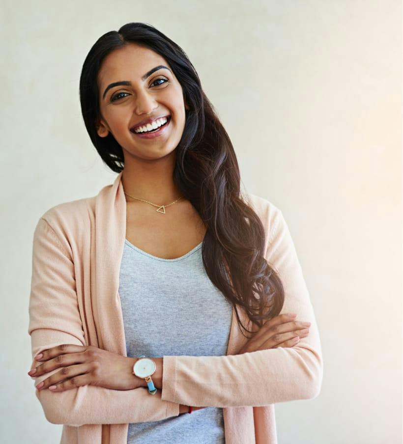smiling woman with crossed arms