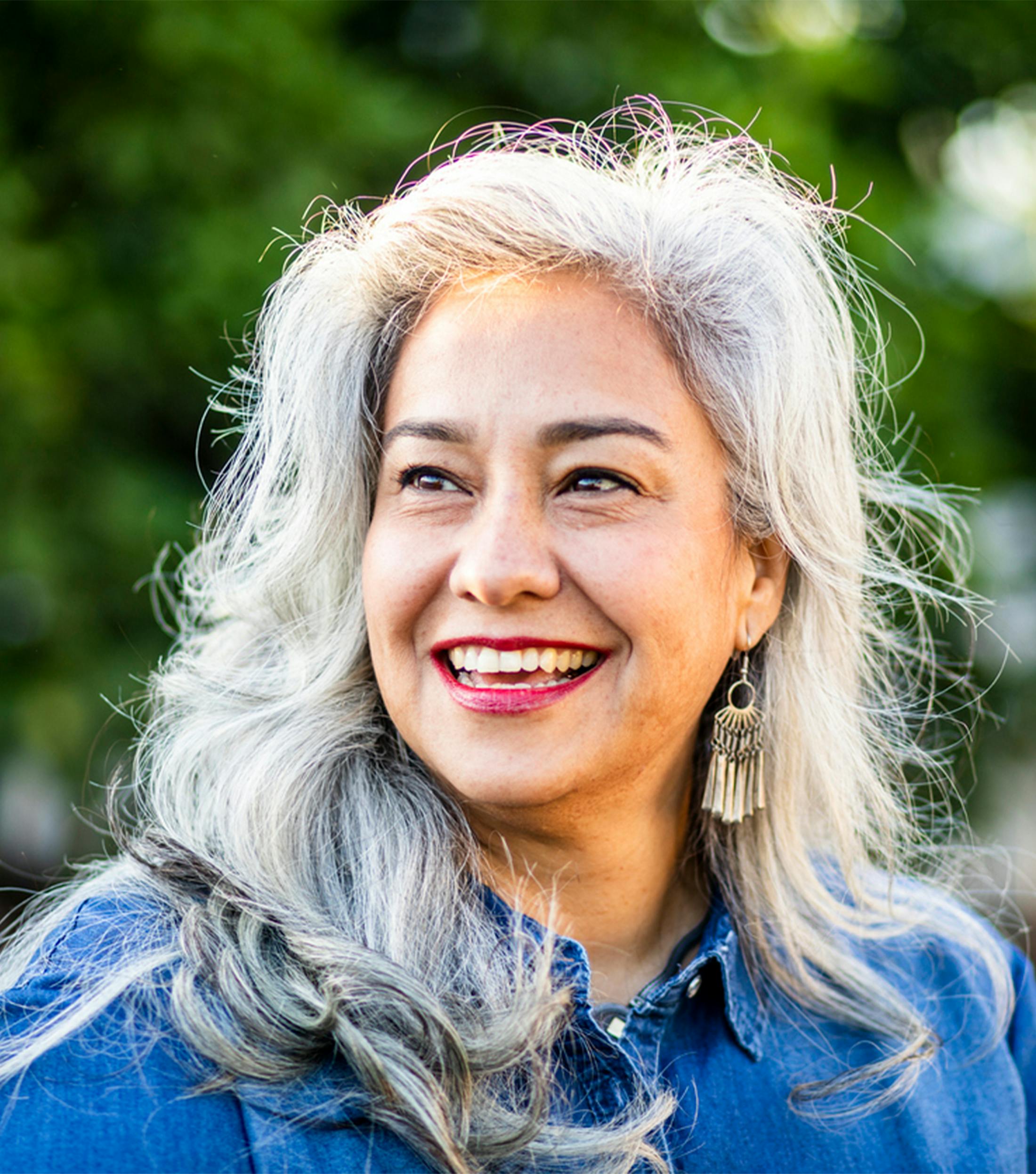 older woman smiling to the side
