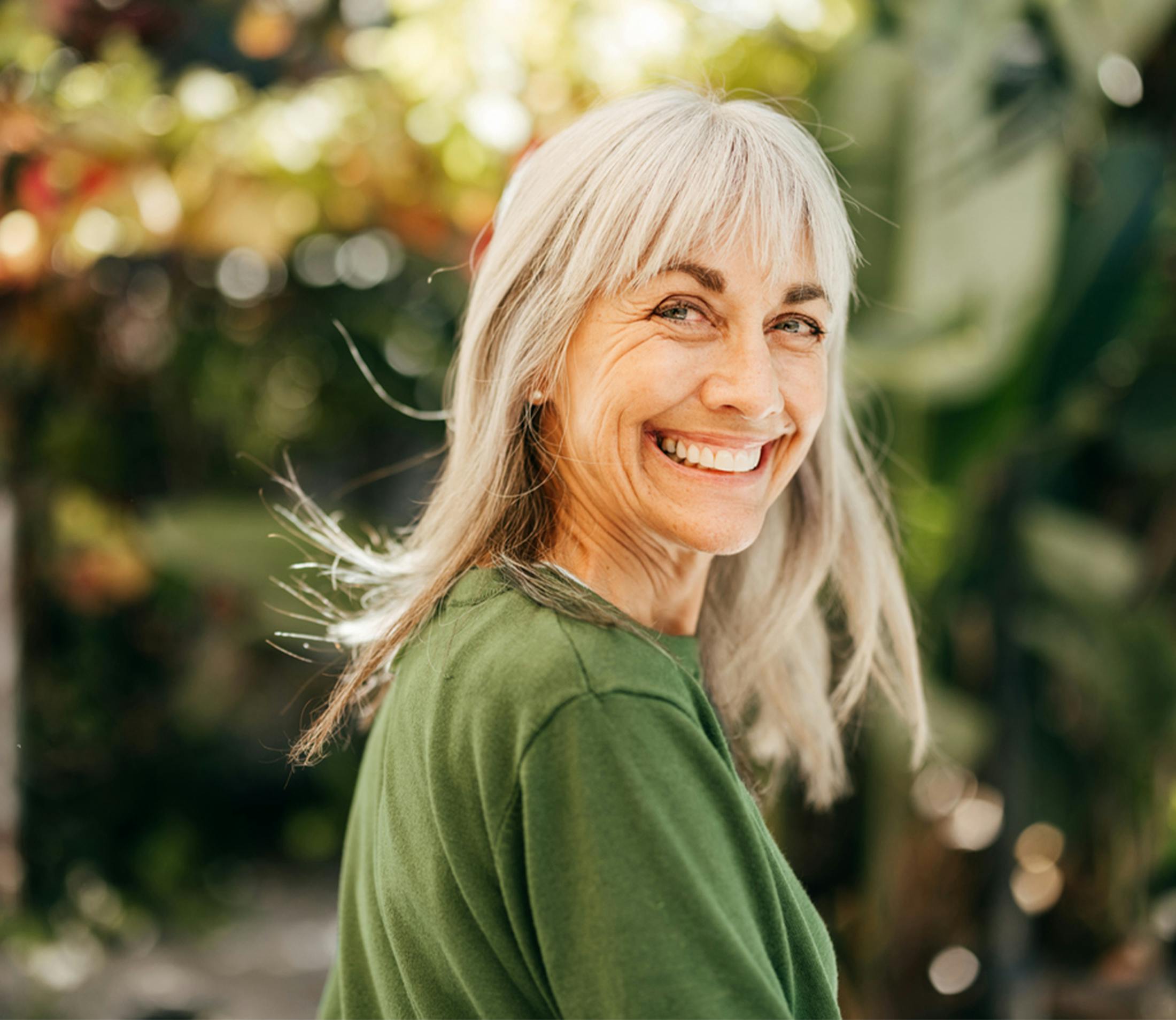woman smiling over her shoulder