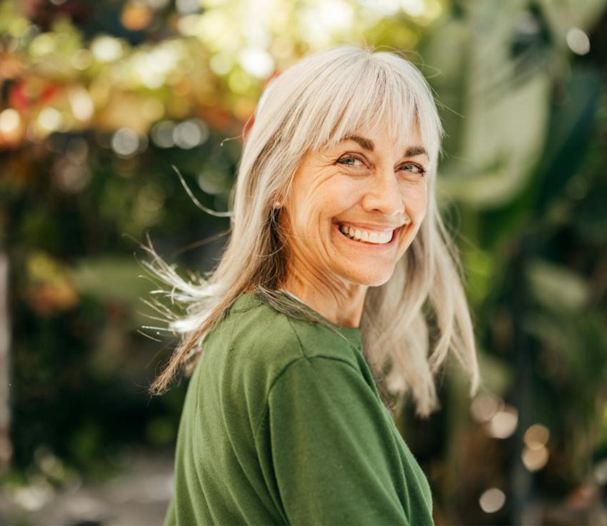 woman smiling over her shoulder