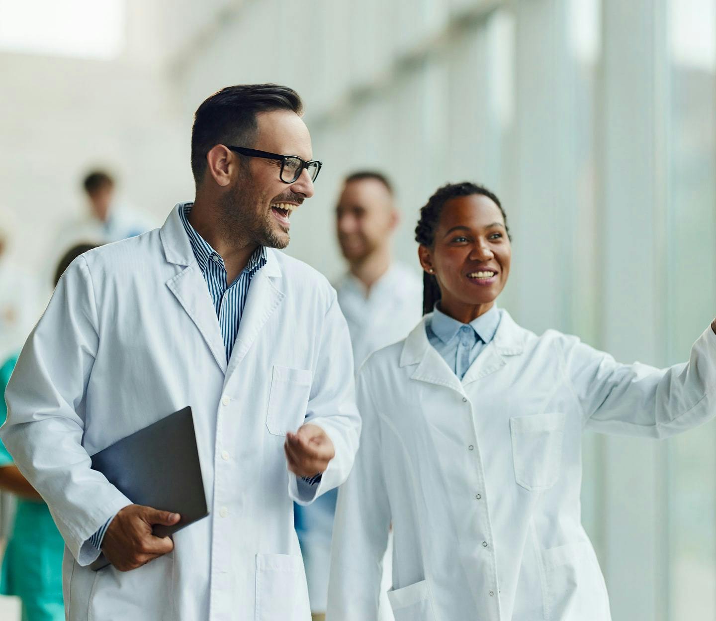 smiling doctors in white coats