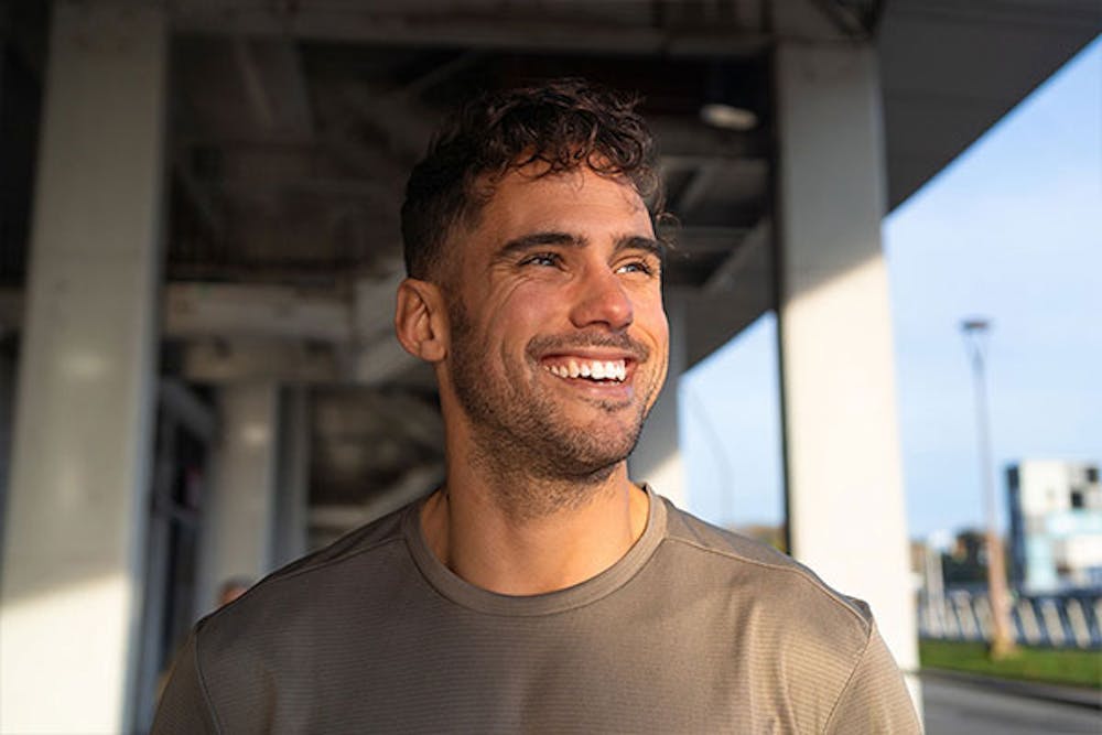 man smiling after his hair transplant in Miami
