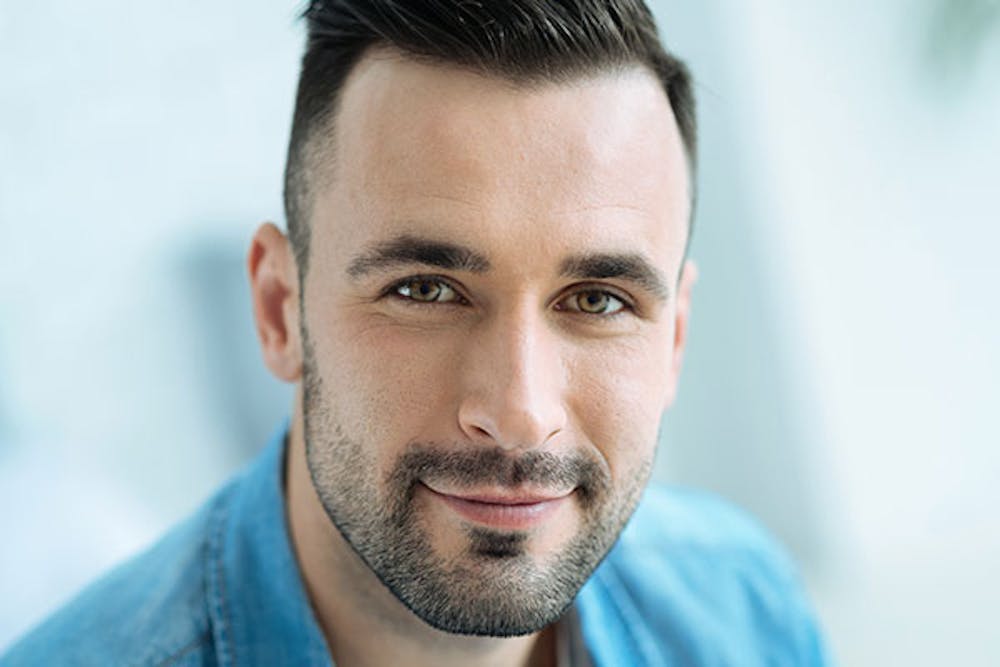 man happy after his rhinoplasty in Miami, FL