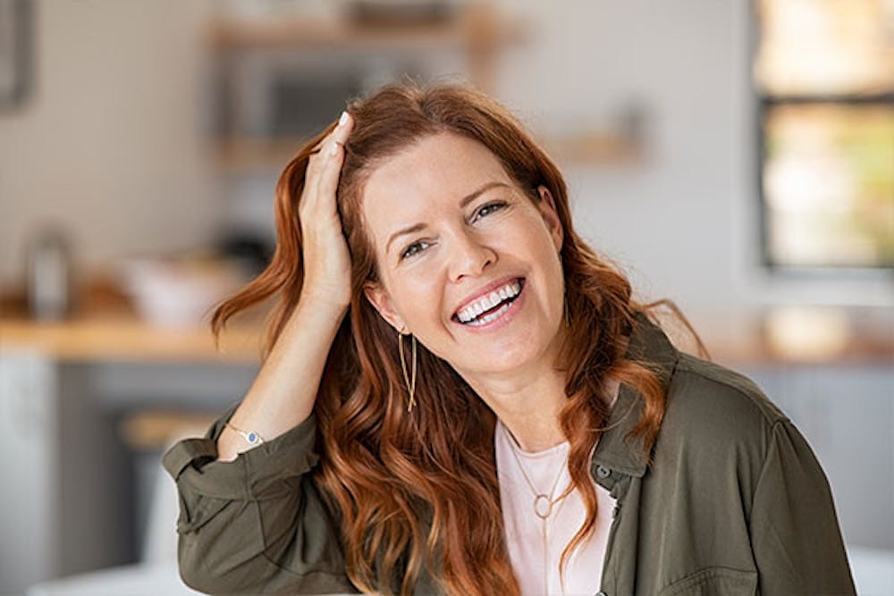 blog-tips-to-maintain-hair-restoration-results-long-term-2 woman after getting hair restoration in Miami, FL
