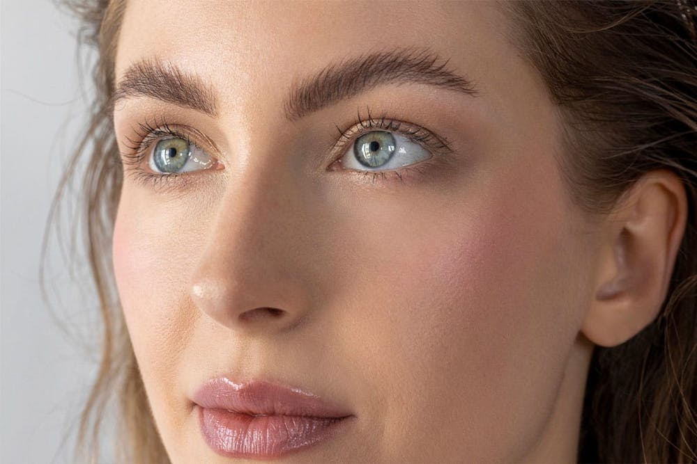 woman after her revision rhinoplasty in Miami, FL