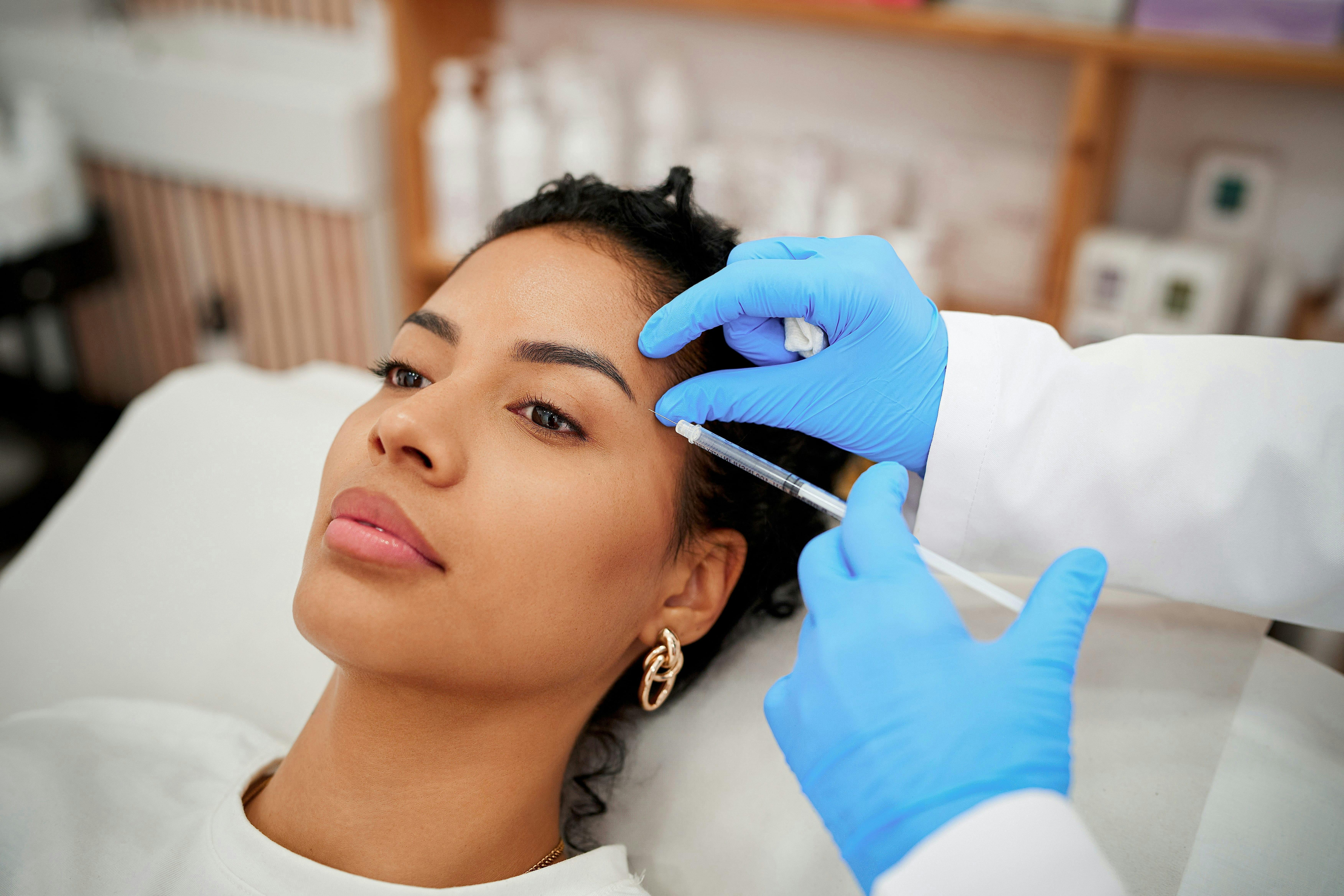 Woman getting facial injection