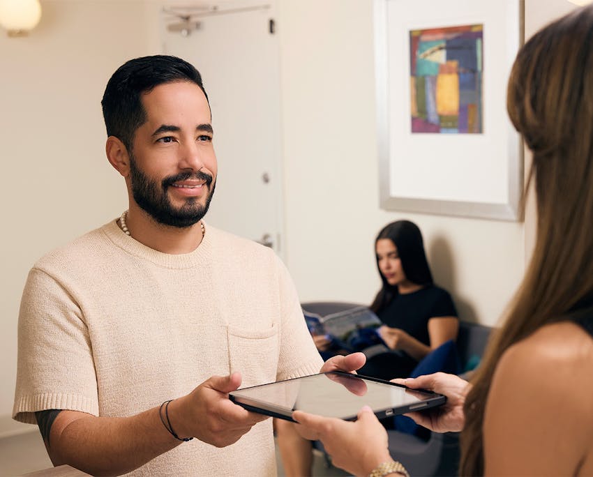 patient holding forms