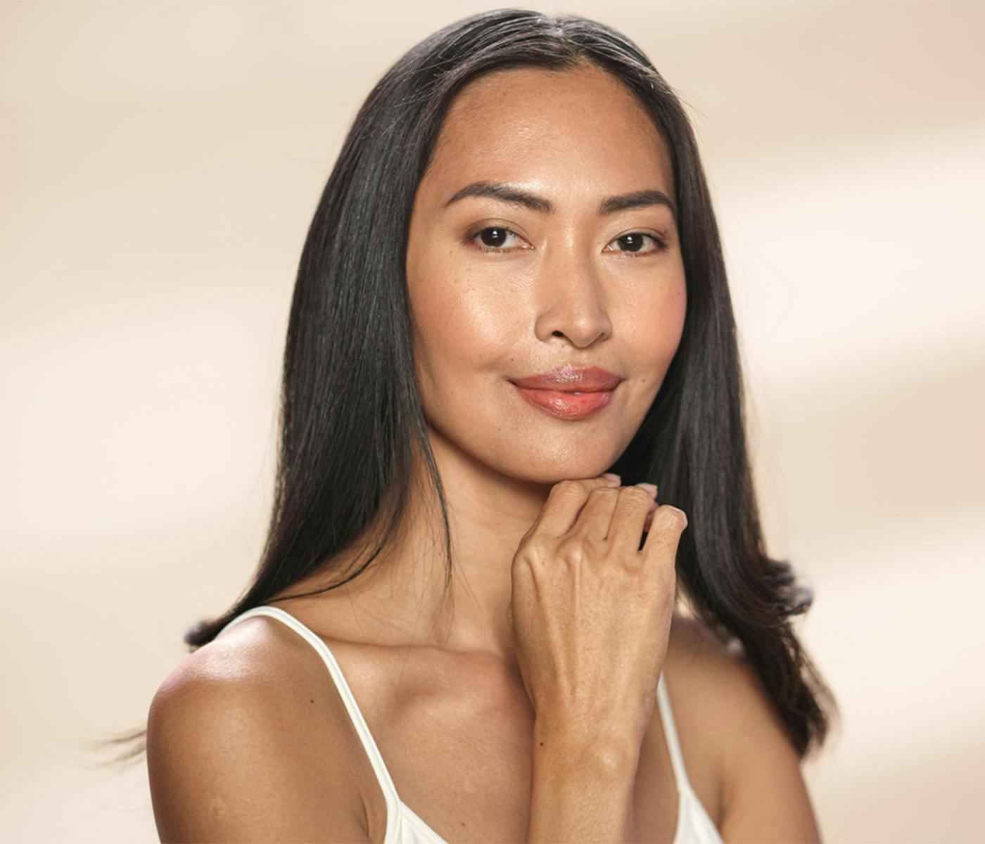 woman touching her chin