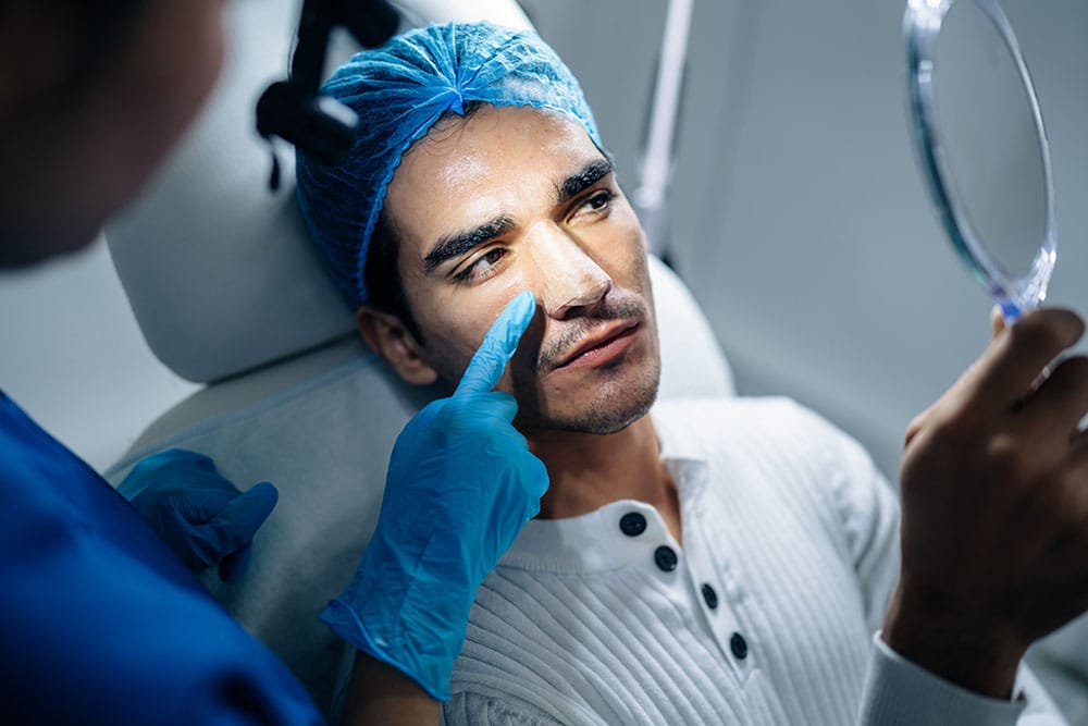 man after his rhinoplasty in Miami, FL