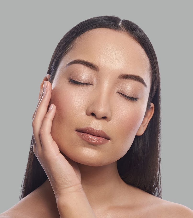 women holding her face