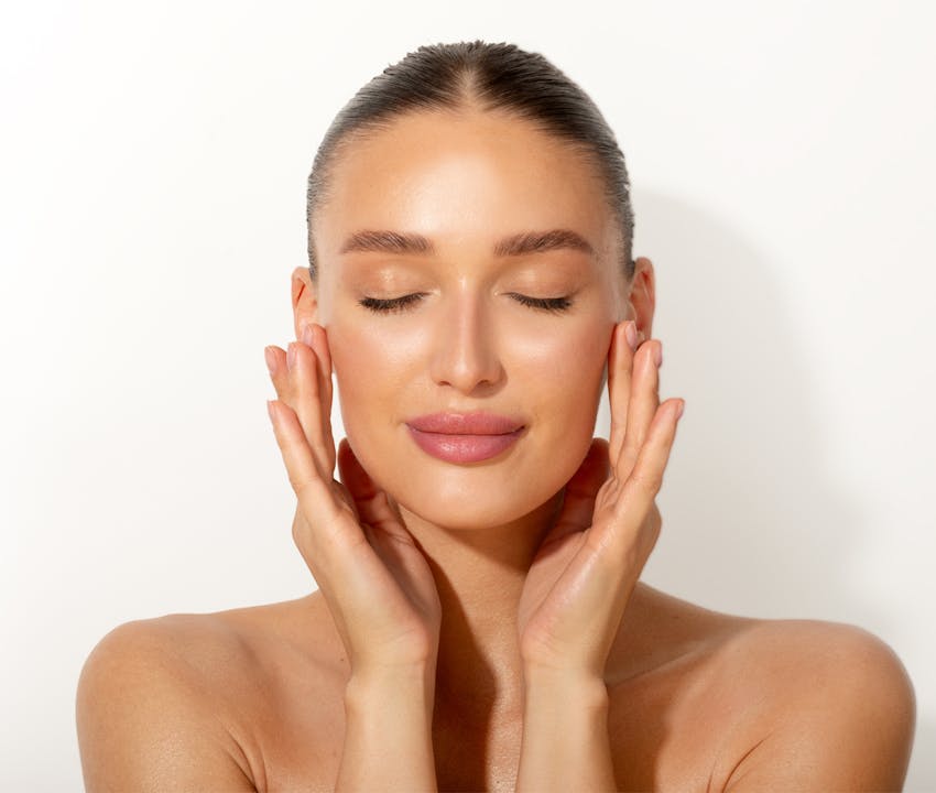 women holding her face