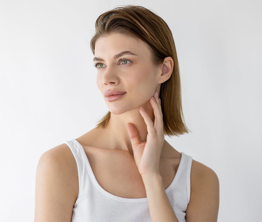 women holding her jawline