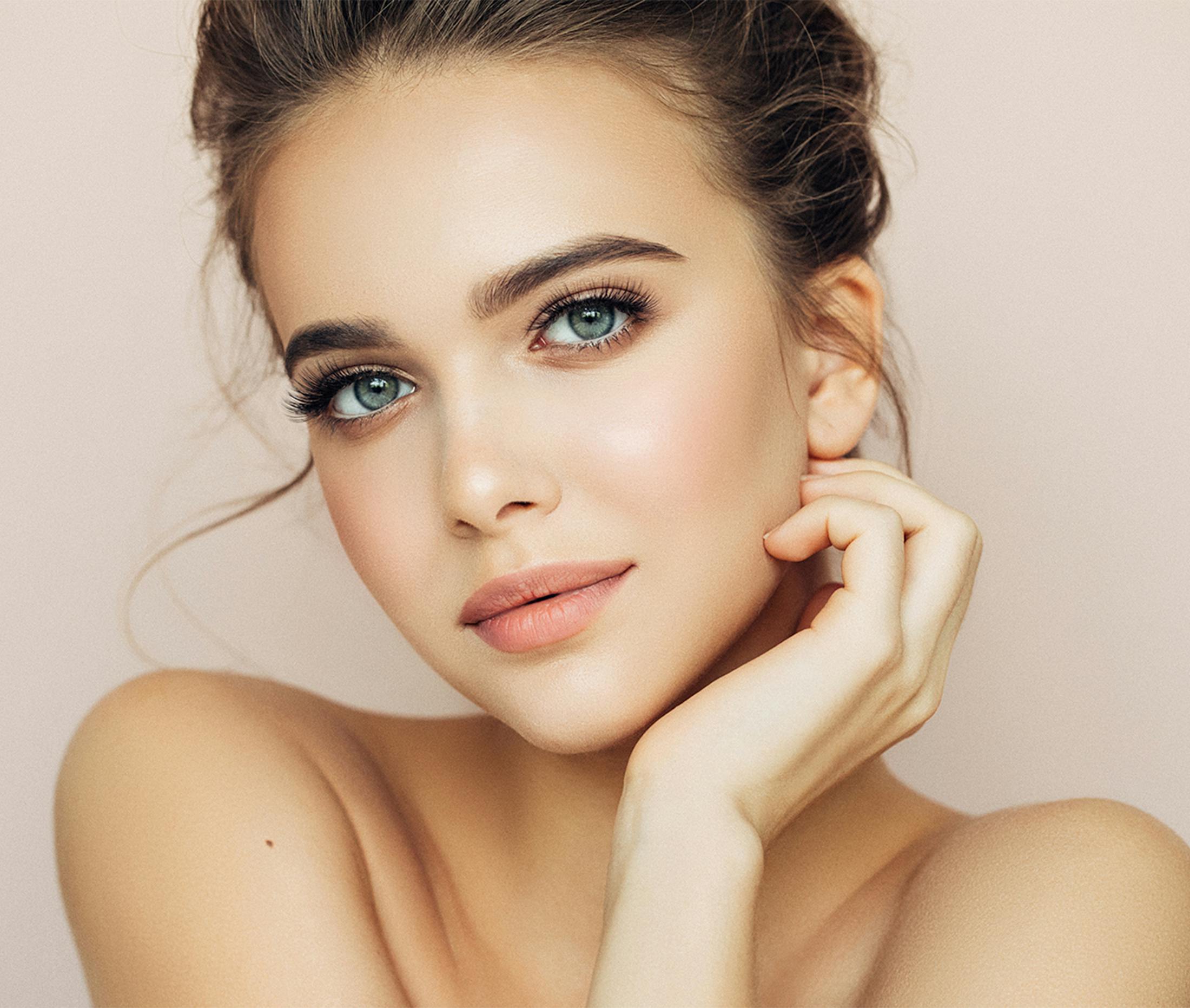 women holding her face