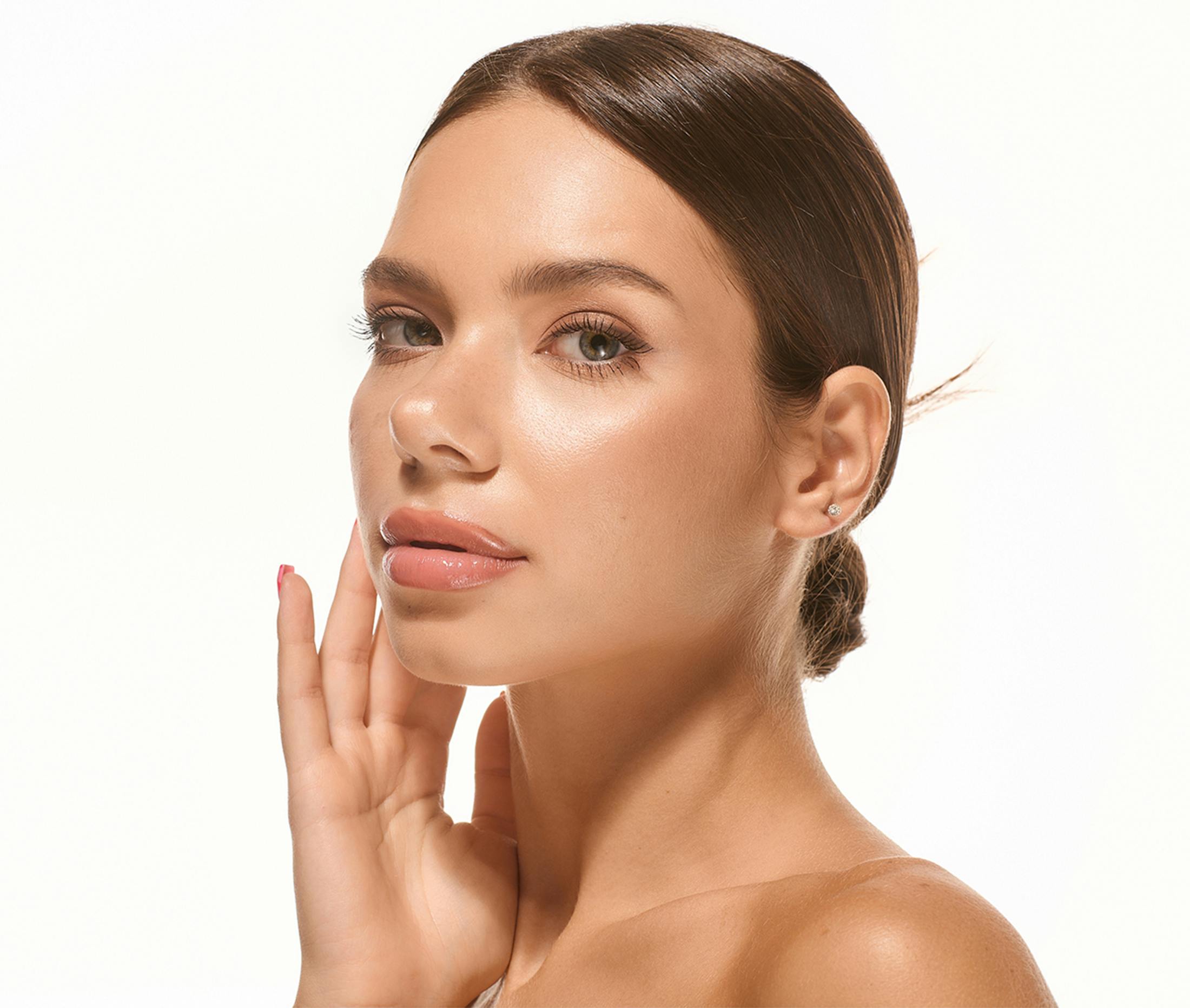 A woman touching her cheek