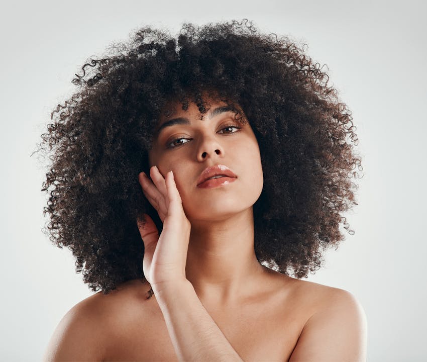 women holding her face