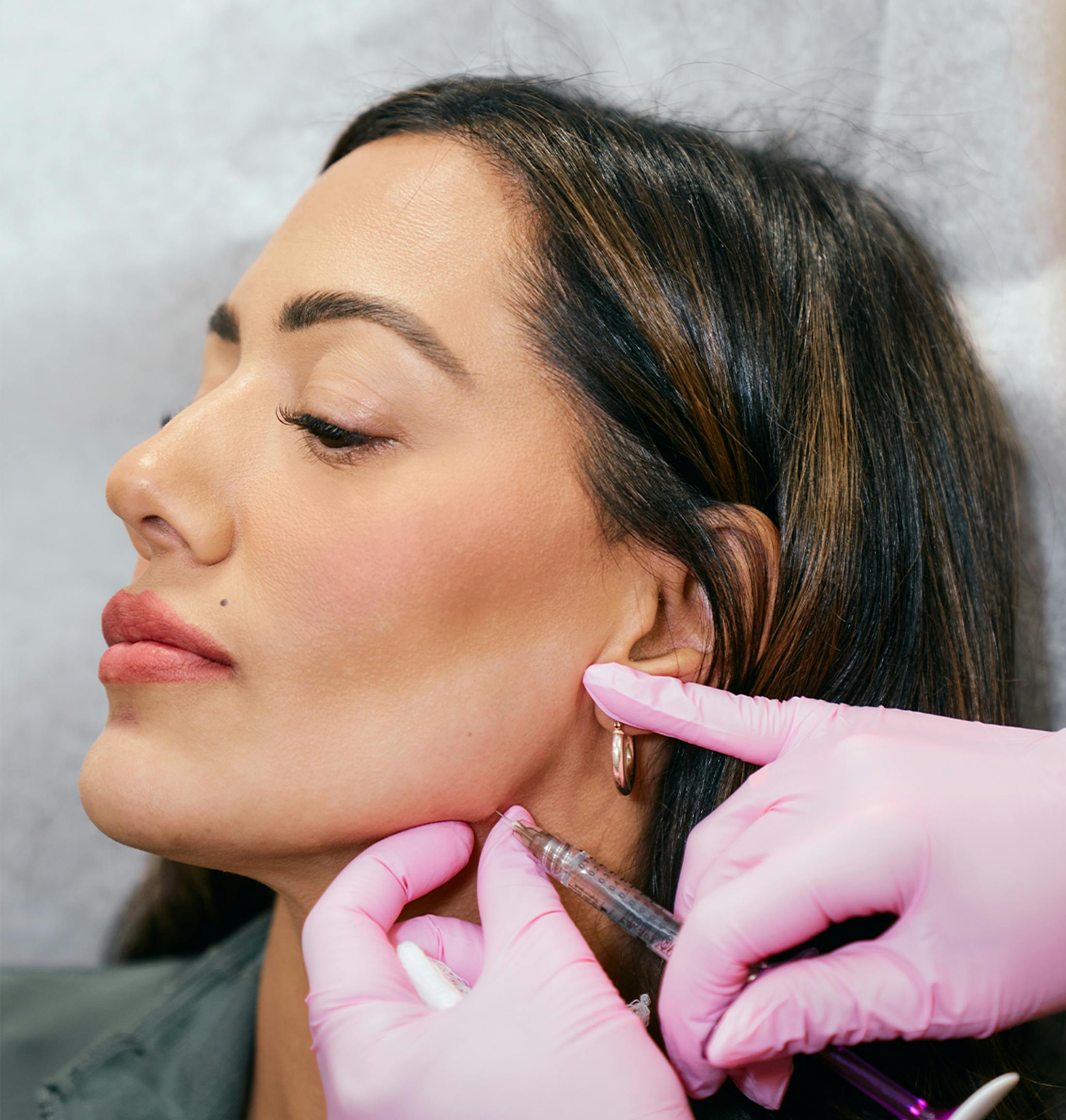 patient being injected at the jawline