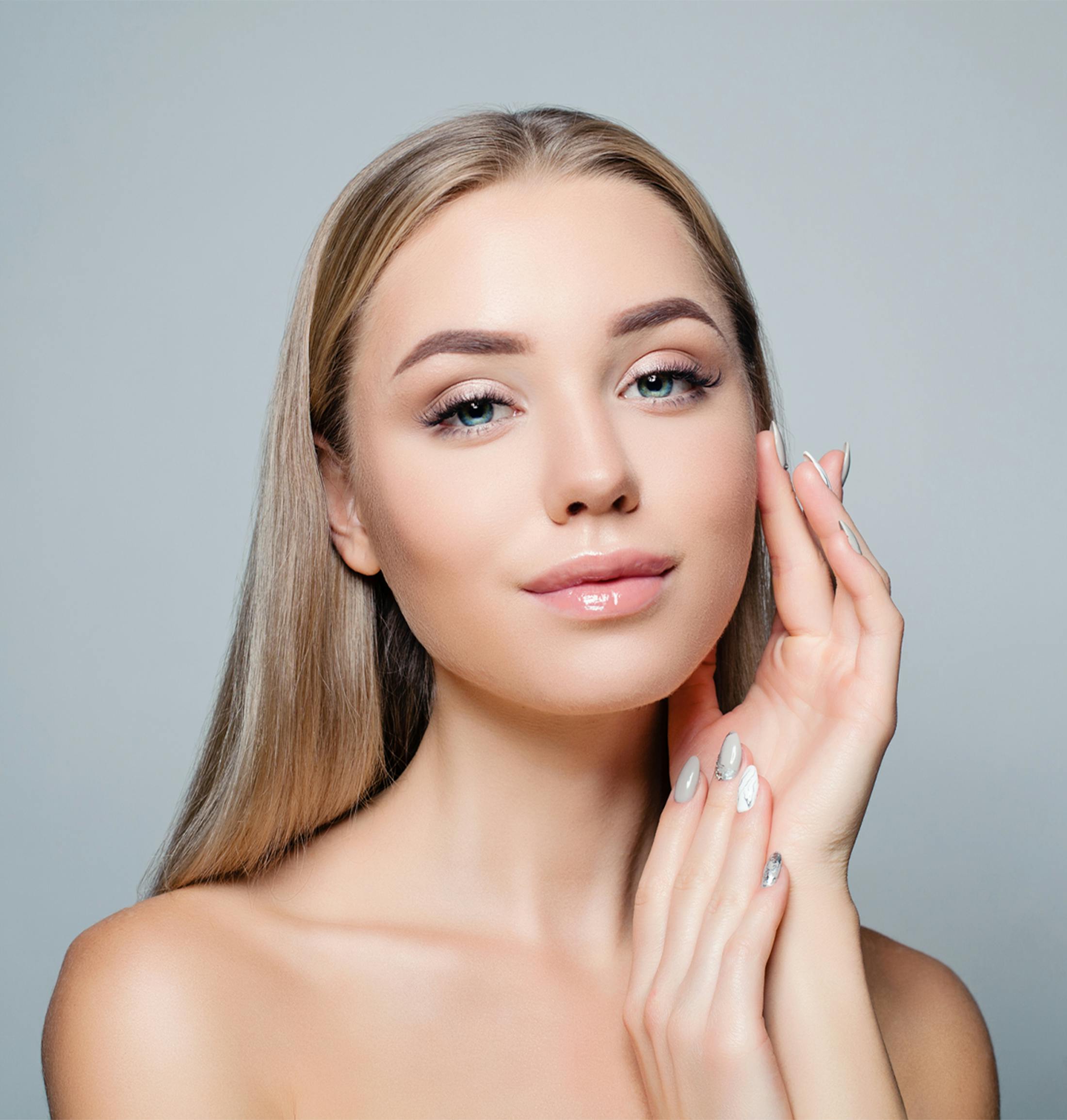 women holding her face