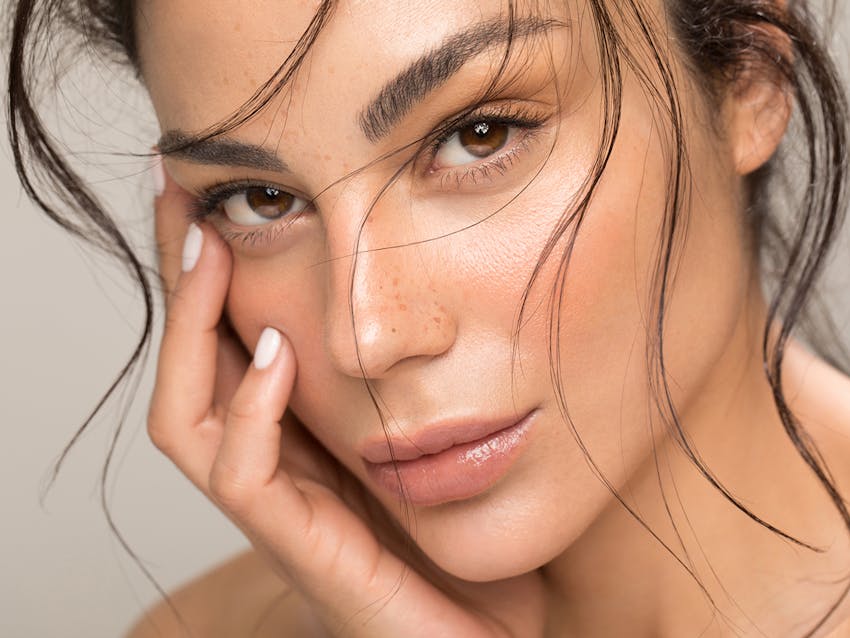 Woman touching her face