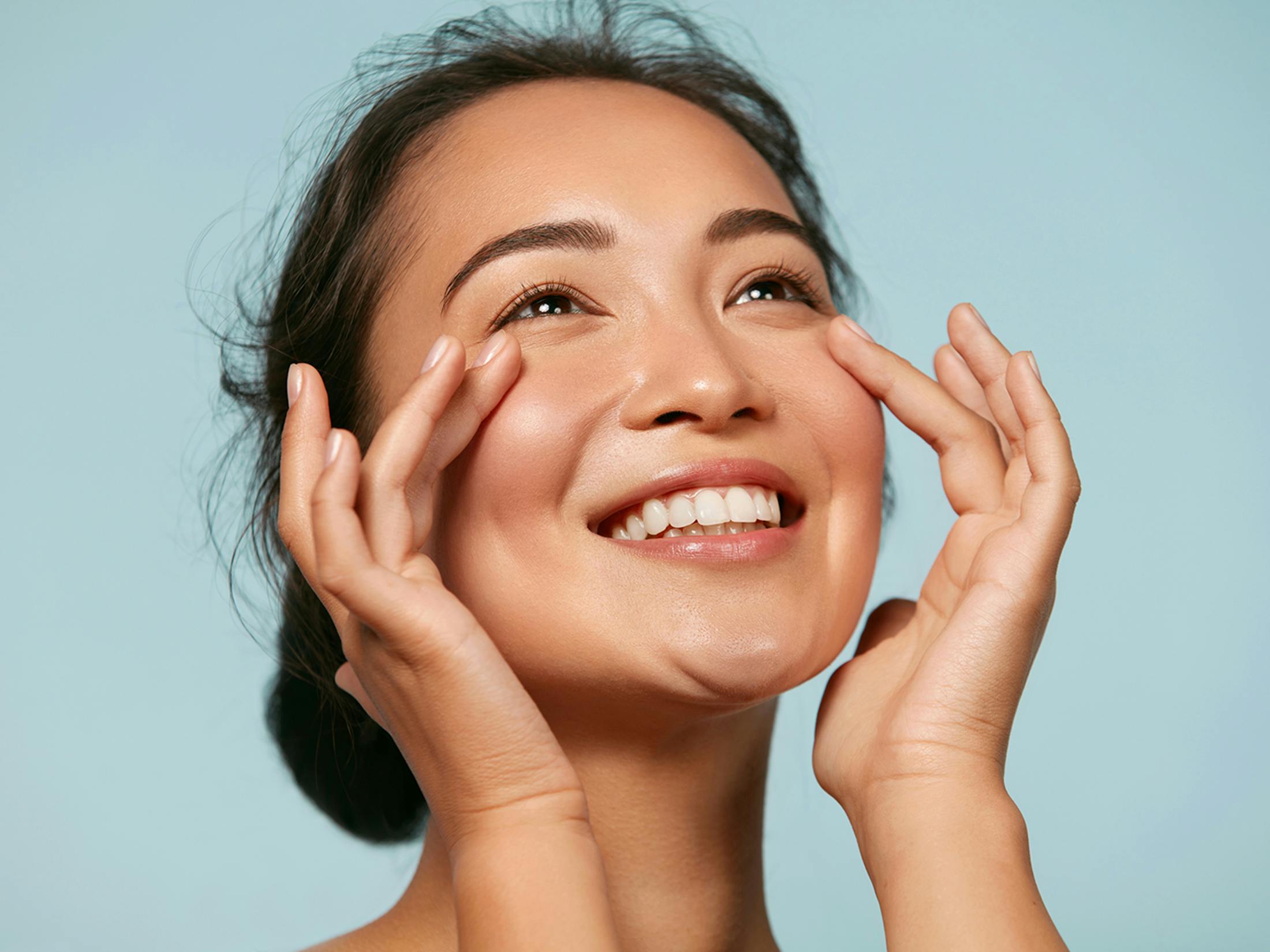 Woman touching her face