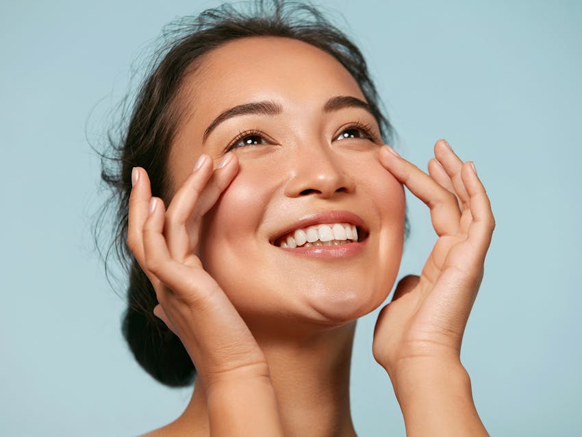 Woman touching her face