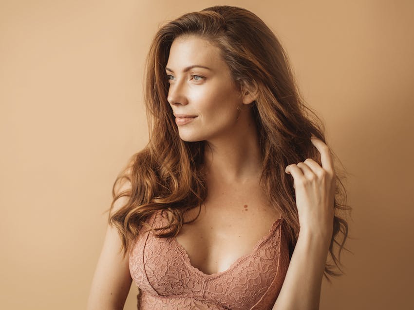 Woman touching her hair