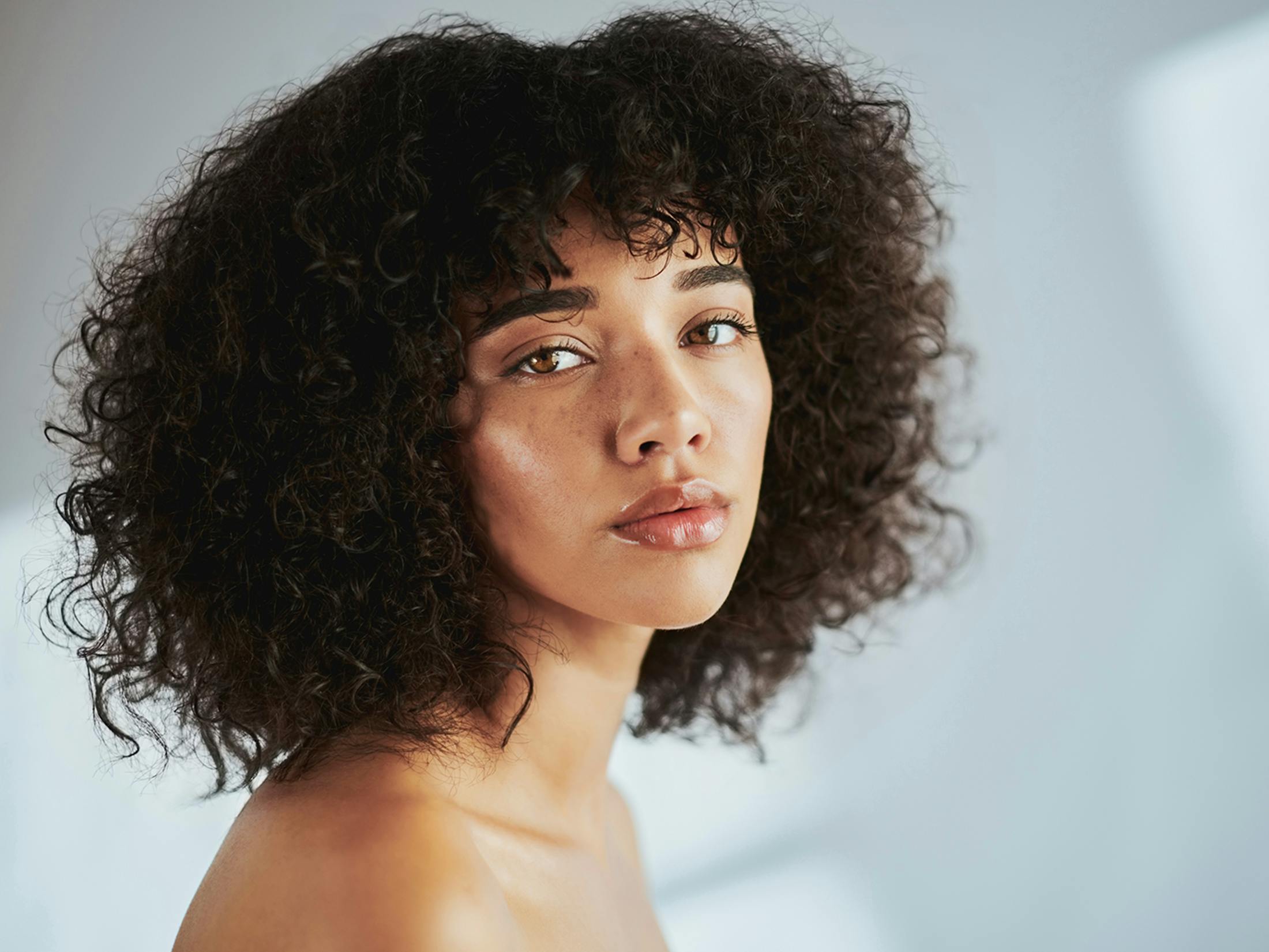 Woman looking over her shoulder