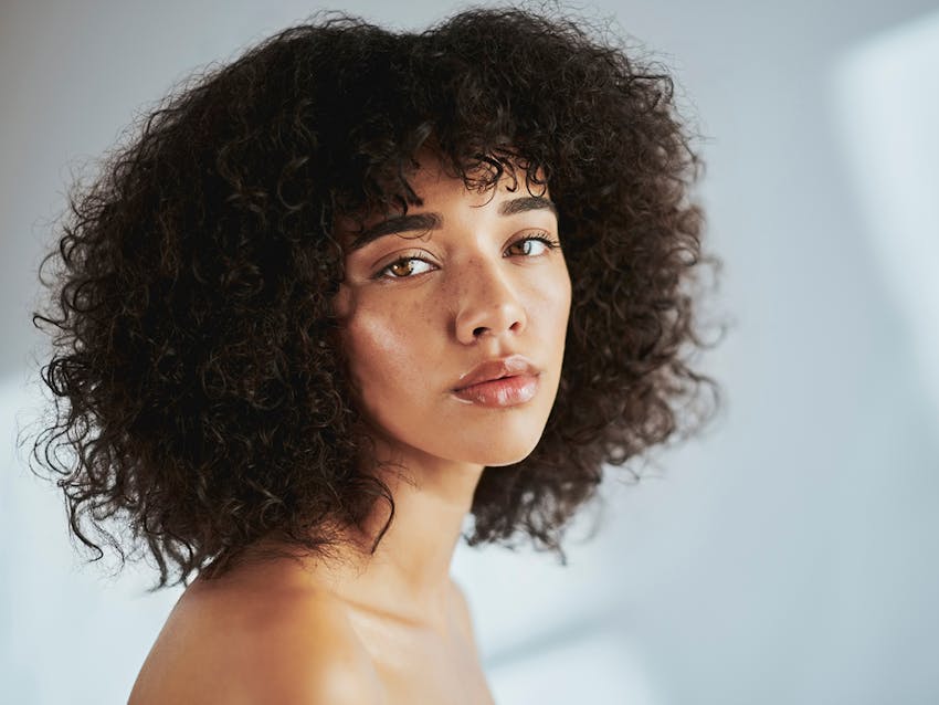 Woman looking over her shoulder