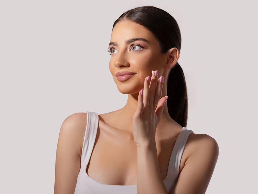 Woman touching her face