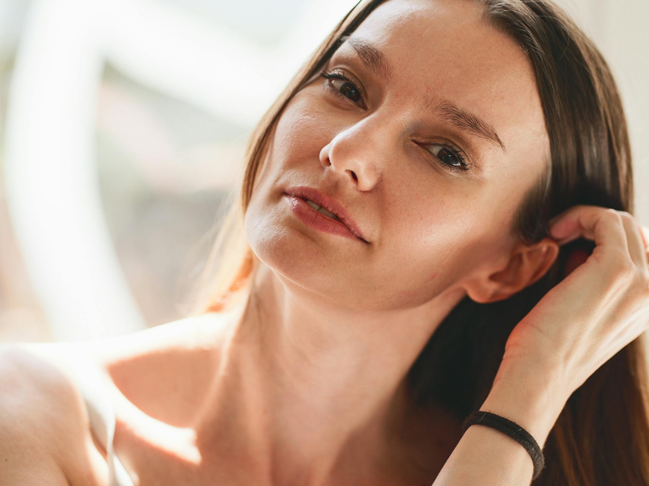 Woman touching her hair
