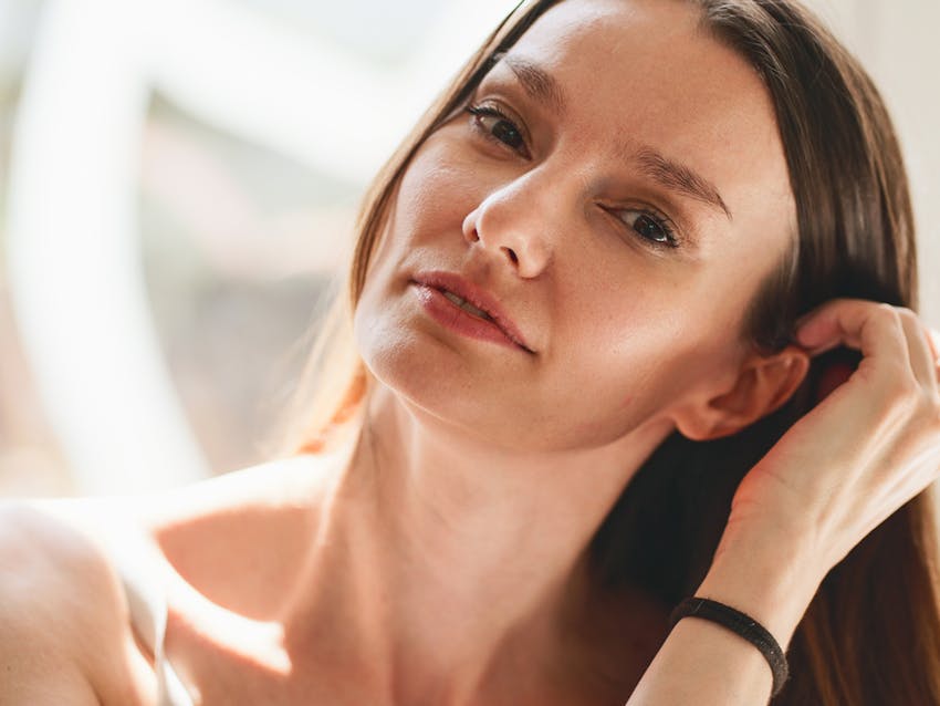 Woman touching her hair