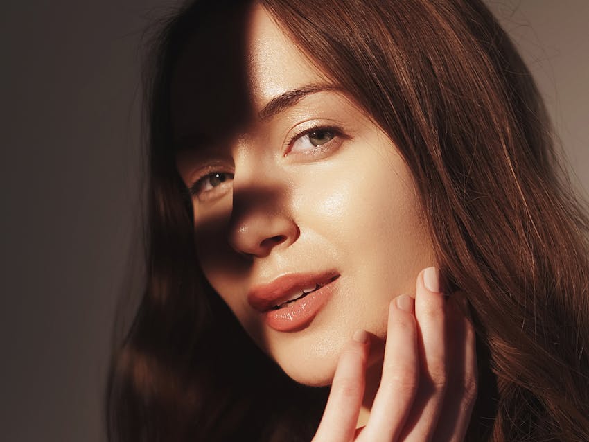 Woman touching her face