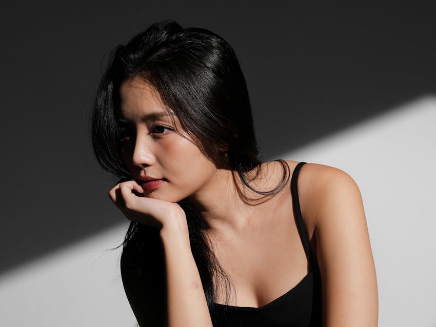 Woman resting her head on her hand