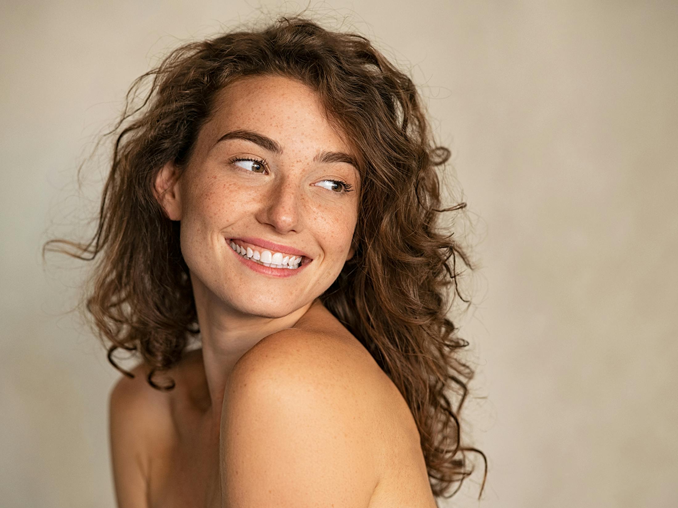 Woman looking over her shoulder