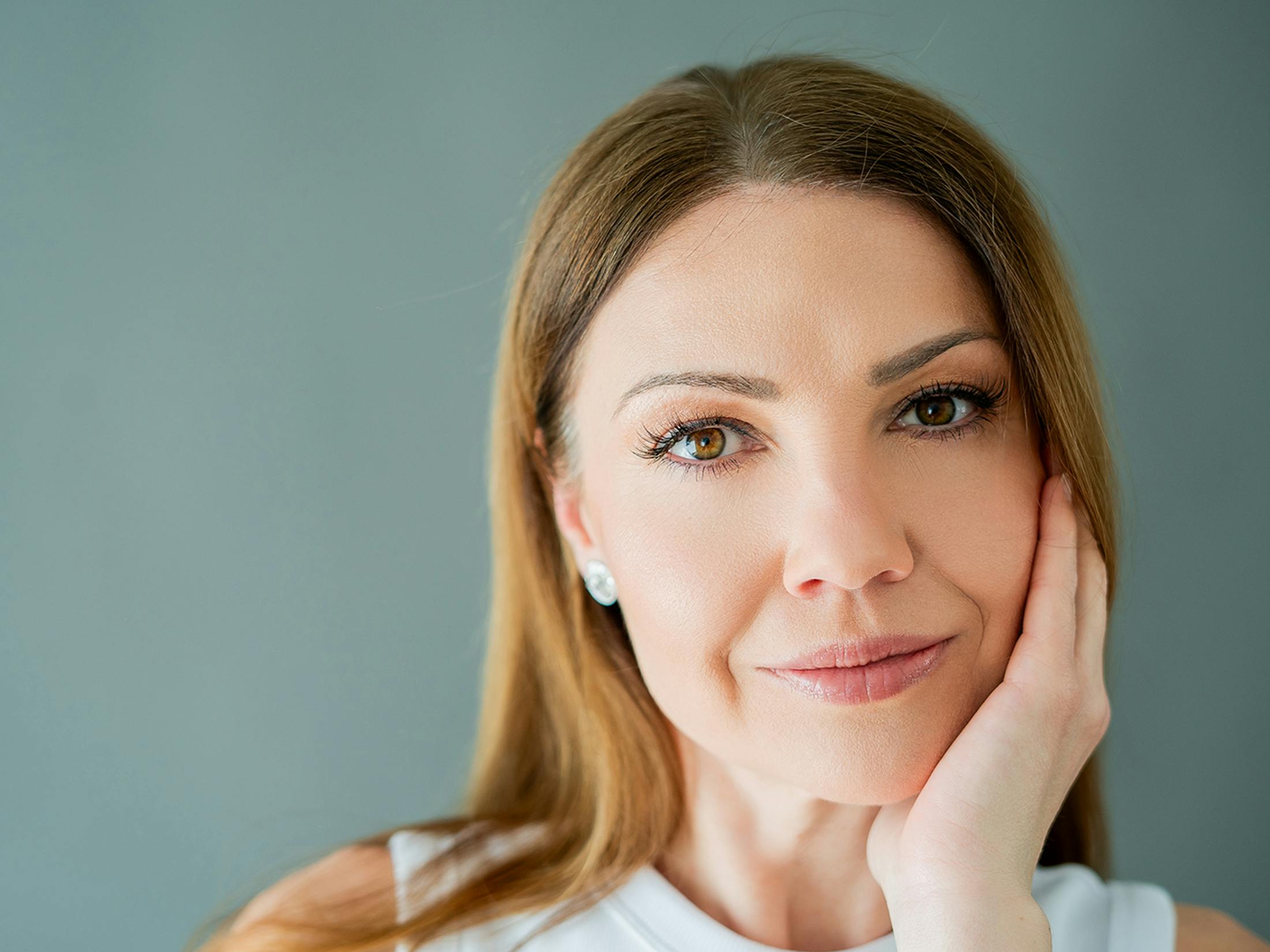 Woman touching her face