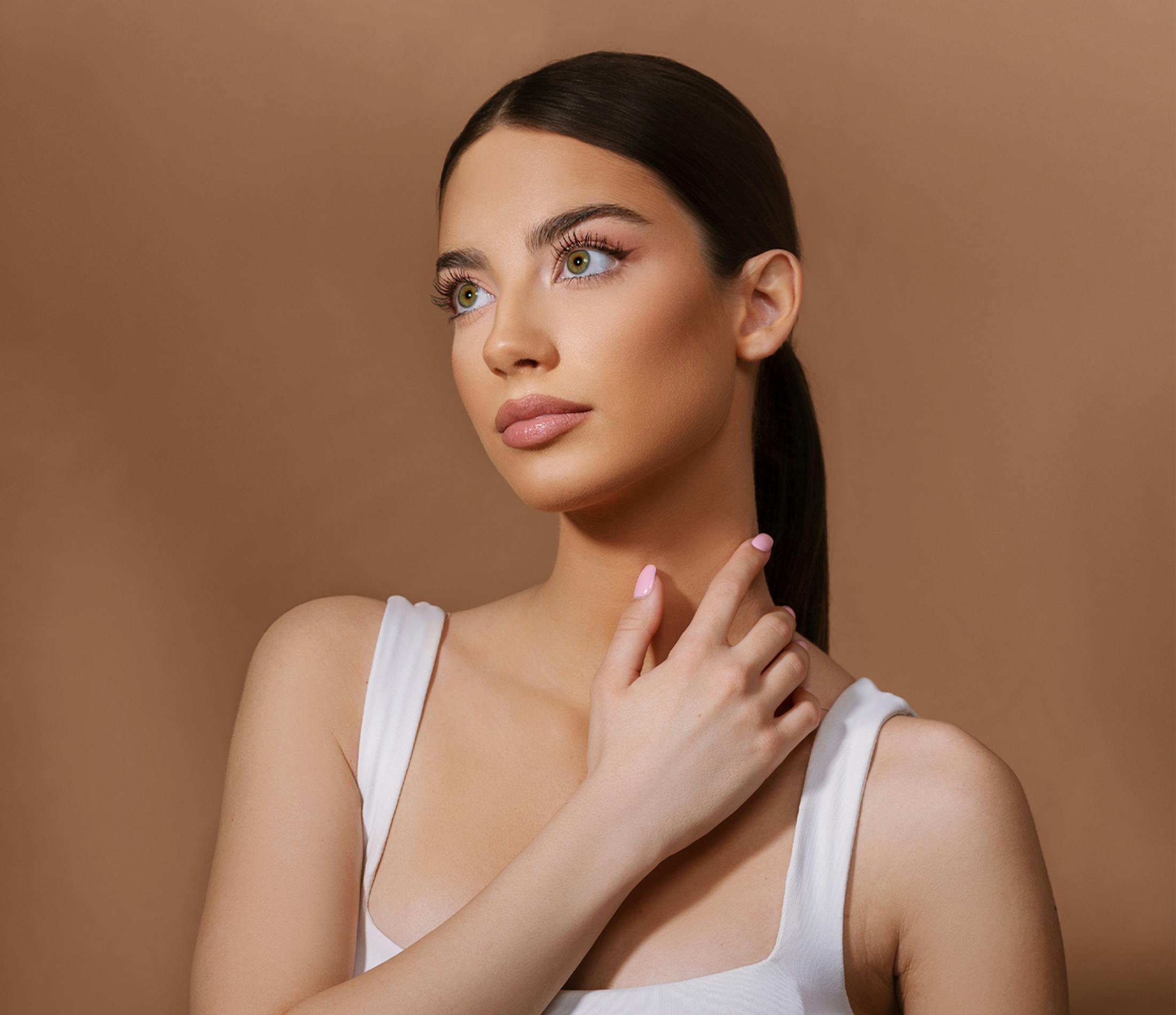 Woman touching her neck