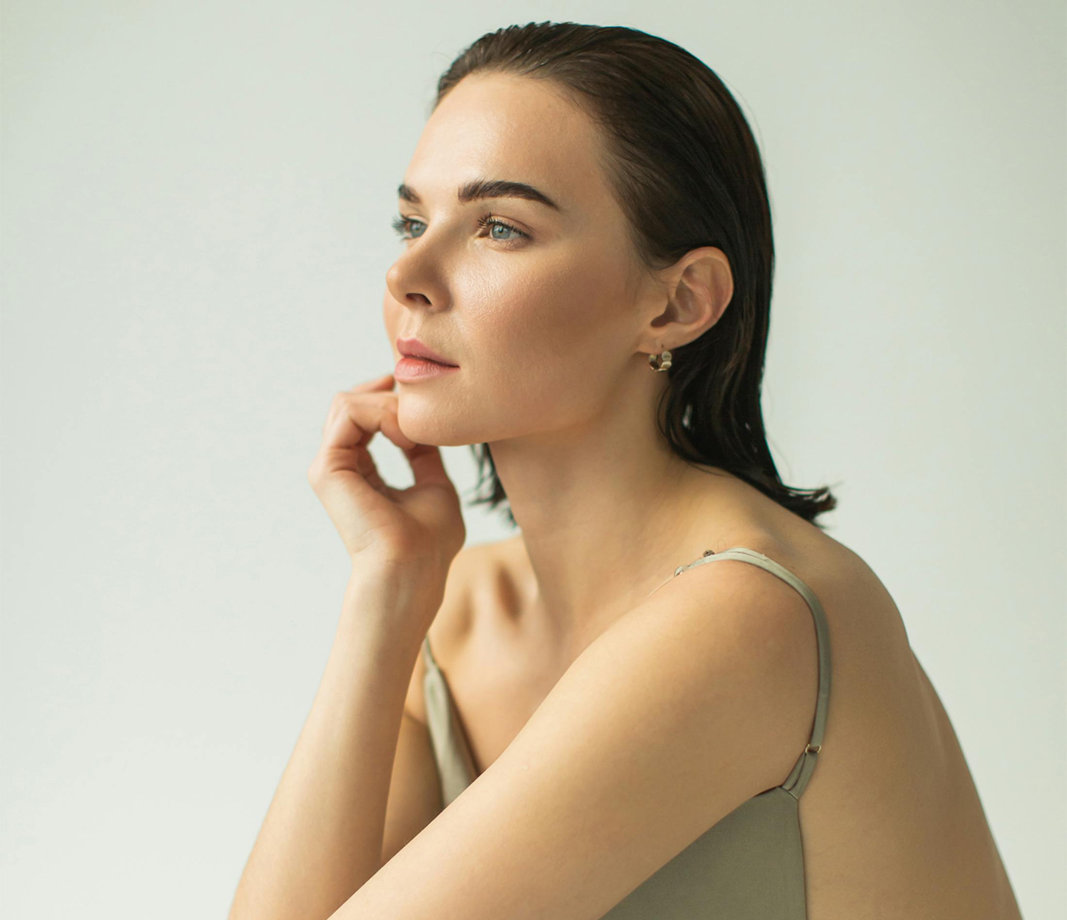 Woman touching her face