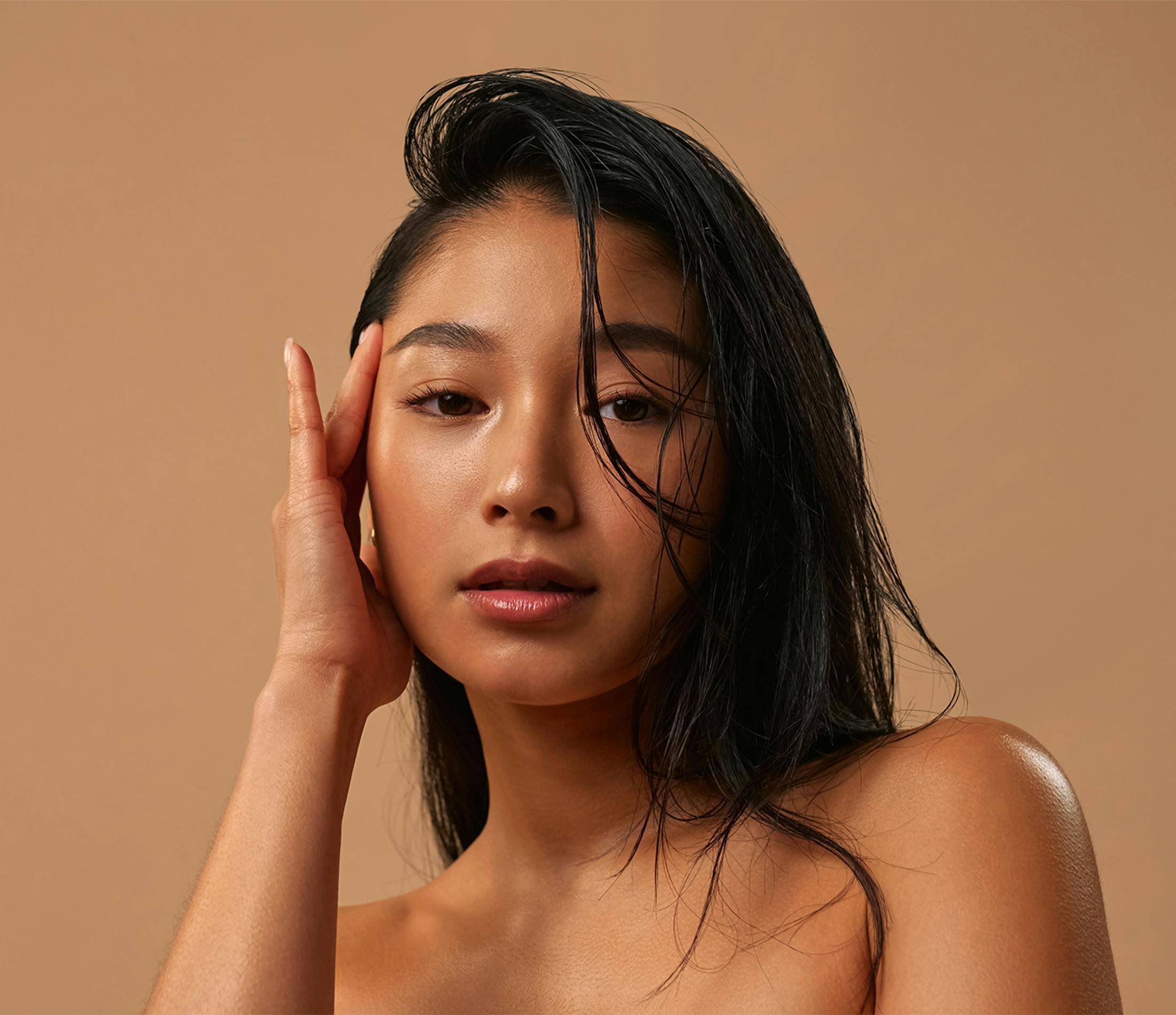 Woman touching her face