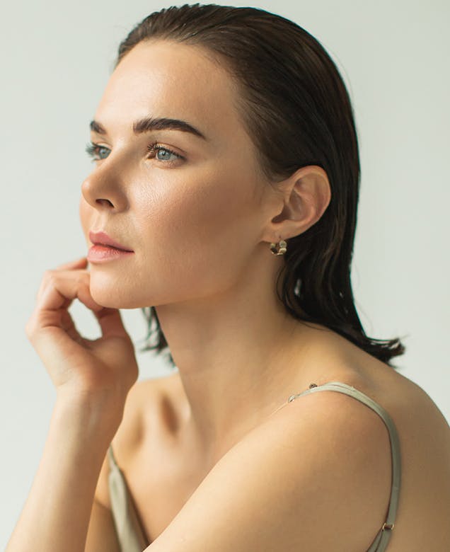 woman with slicked back hair