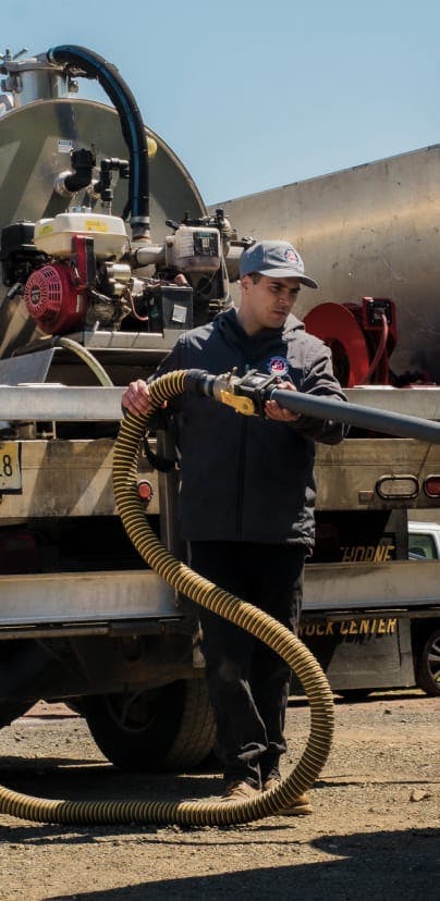 plumber with hose