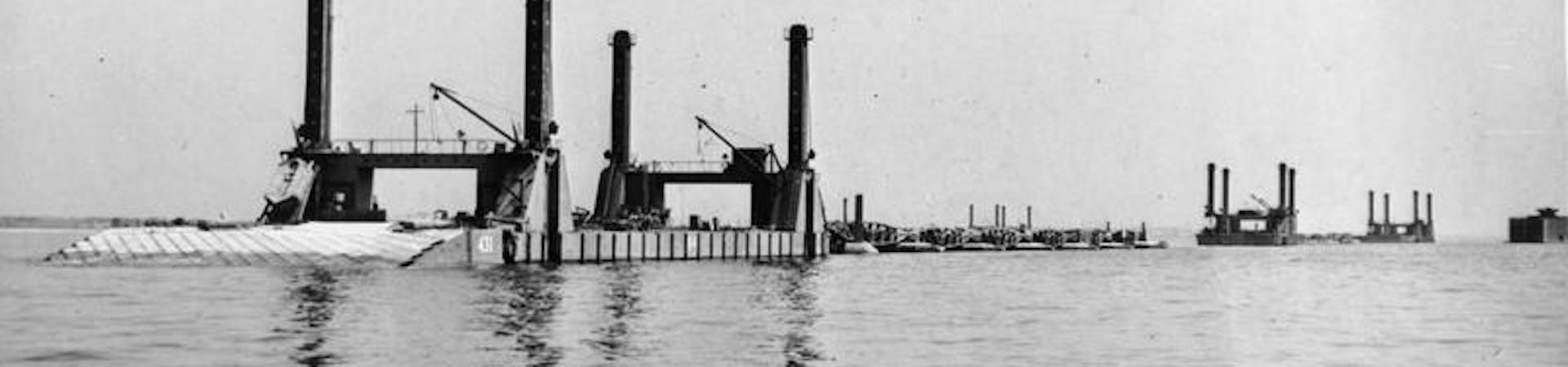Mulberry Harbour: Spud pierheads at anchor off Selsey Bill. They are part of the prefabricated Mulberry ports, various components of these, known as Phoenixes and Whales, were assembled here during the three weeks preceding D-Day.