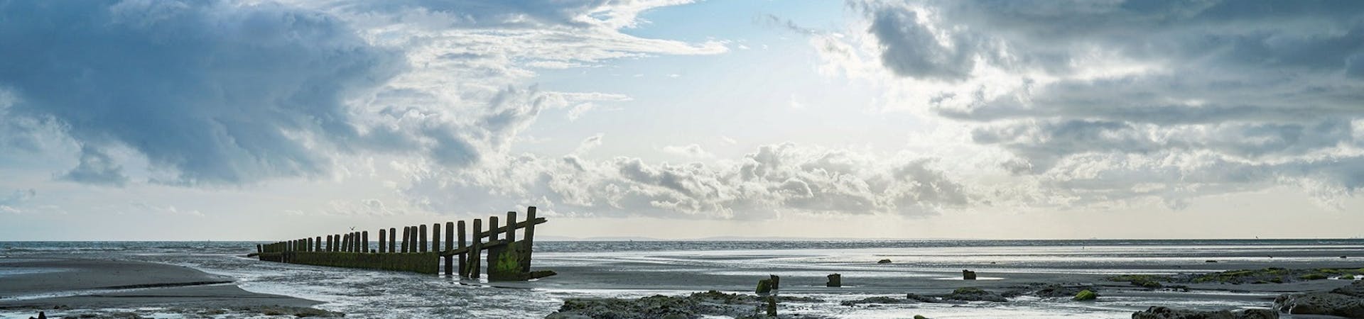 Medmerry beach with the tide out on a cloudy day