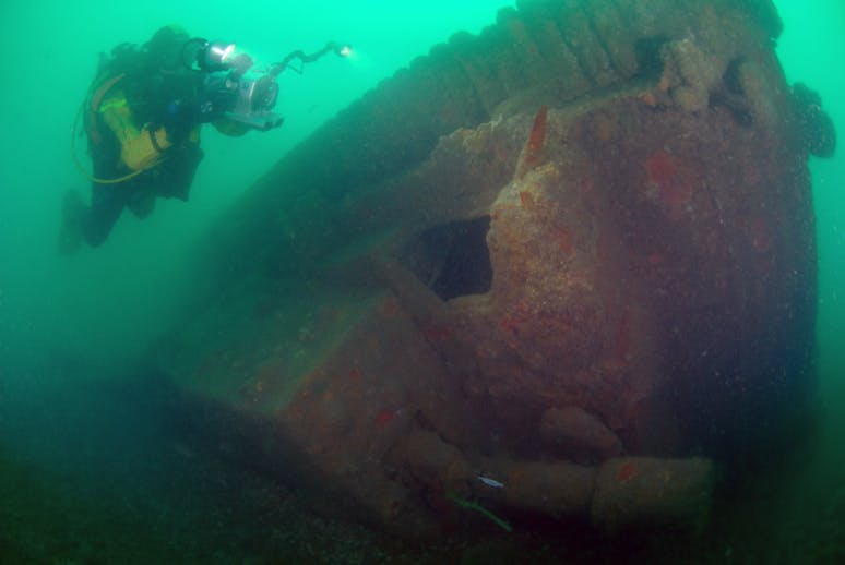 Diving Tanks & Bulldozers Credit: Martin Davies Day Image taken by Martin Davies Day of a diver, diving the tanks and bulldozers