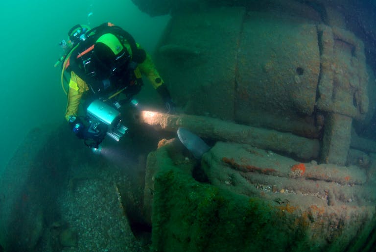 diver investigating the wreck of the bulldozer