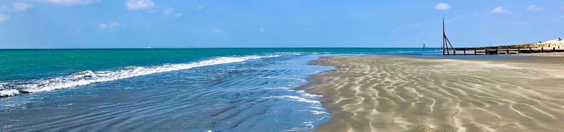 The tide out at Oval Field Beach revealing a sandy stretch