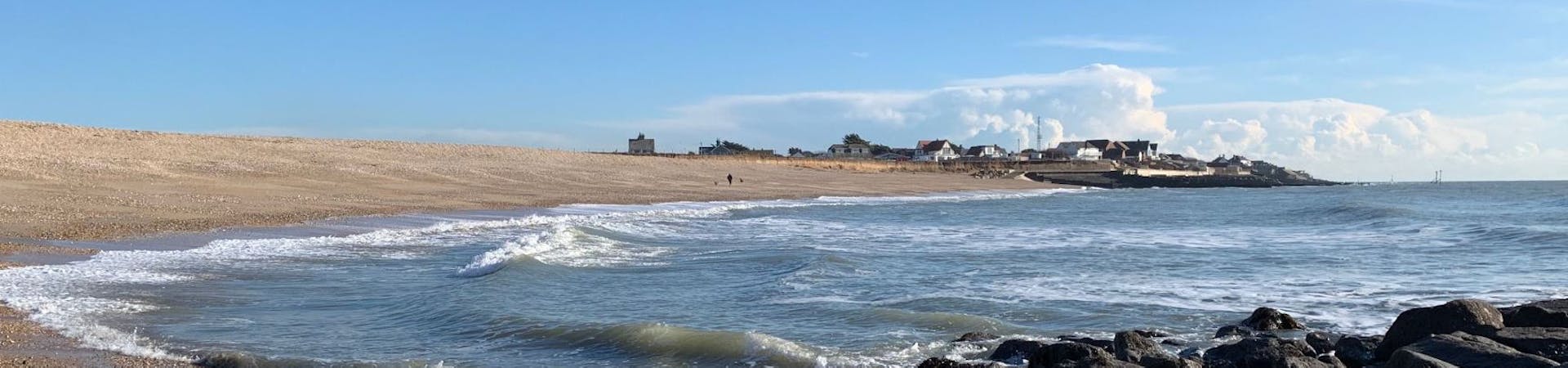 the curve of the beach sweeping around